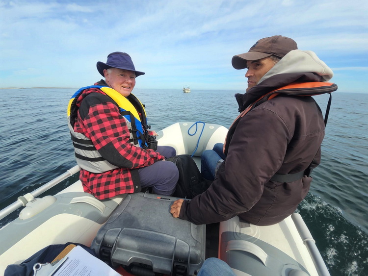 Richard Donaldson and Bertin D'Eon leaving Round Island in the Zodiac